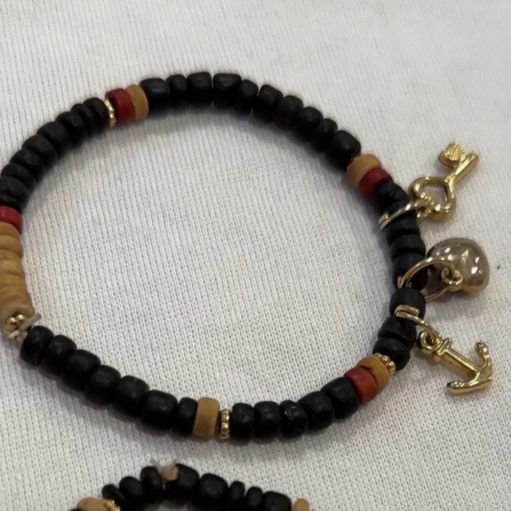 2 Black bracelets with gold charms